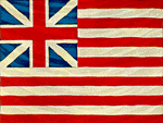 Grand Union flag consisting of thirteen red and white stripes with a Union Jack at the top left.