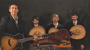 Four musicians at funeral for broken guitar.