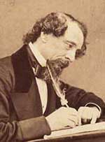 Charles Dickens writing with a quill pen.