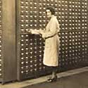 Woman looking in card catalogue.