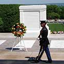 Honor guard marching in front of the Tomb of the Unknowns at Arlington National Cemetary.