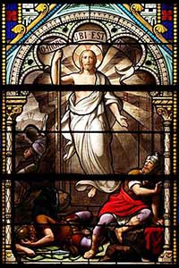 Stained glass window image of the Resurrection of Christ.