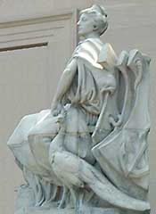 Statue of seated woman.