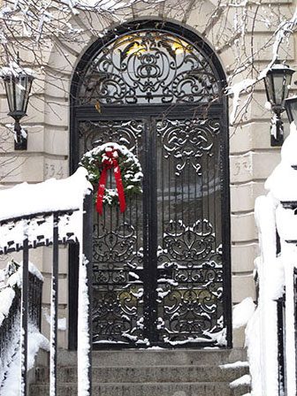 Photo of doorway with snow-covered wreath