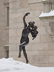 Statue dancing in the snow at the Boston Public Library